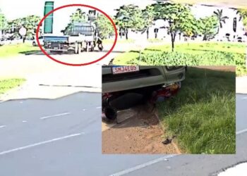 IMPRUDÊNDIA | Câmera de segurança flagra momento em que moto cai e fica presa sob caminhão em rodovia de MT